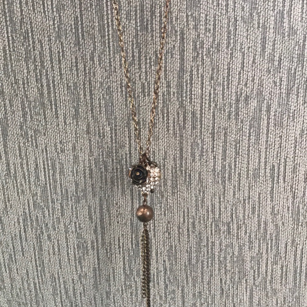 Necklace with heart, key, and ball